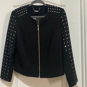 Black jacket with stud detail.